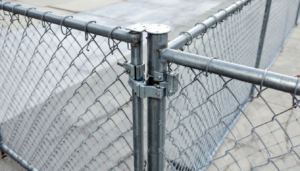 Key components of a chain link fence including posts and gates.