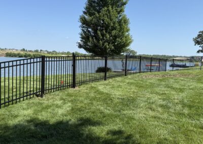 3 rail flat top steel fence at lake
