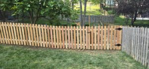 old vs new wood picket fence